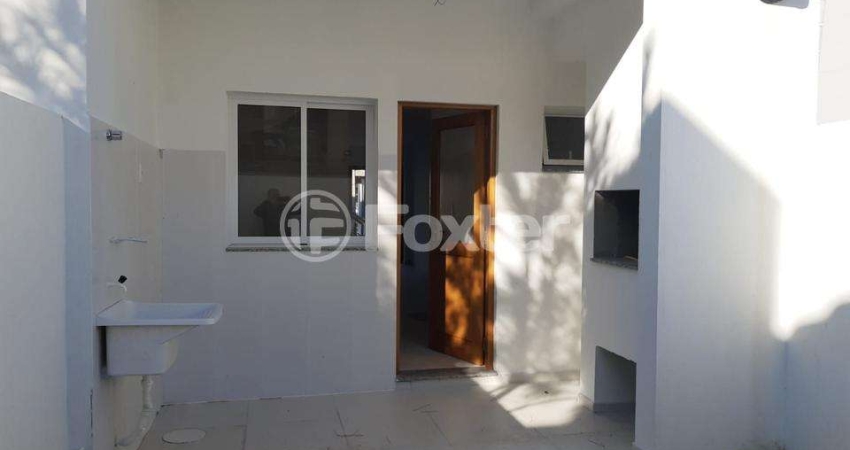 Casa com 3 quartos à venda na Rua Itacyr Rossi, 191, Guarujá, Porto Alegre