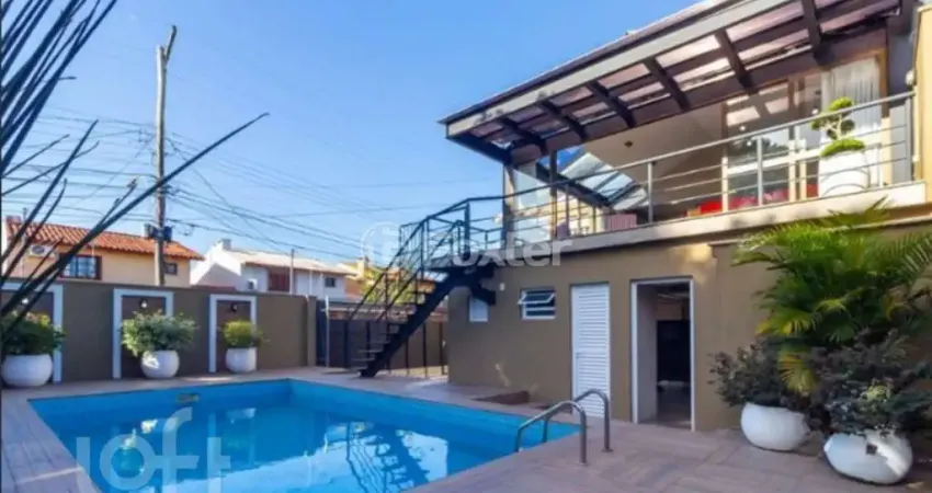 Casa com 4 quartos à venda na Rua Criciúma, 115, Guarujá, Porto Alegre