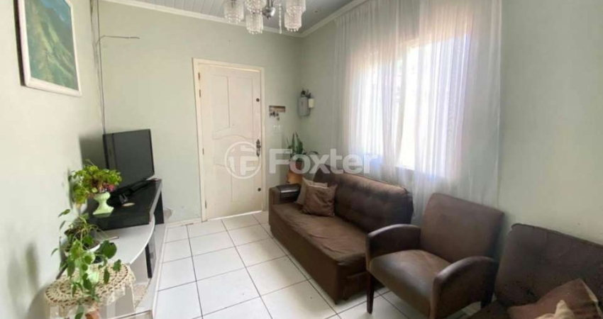Casa com 5 quartos à venda na Rua Afonso Arinos, 909, Camaquã, Porto Alegre