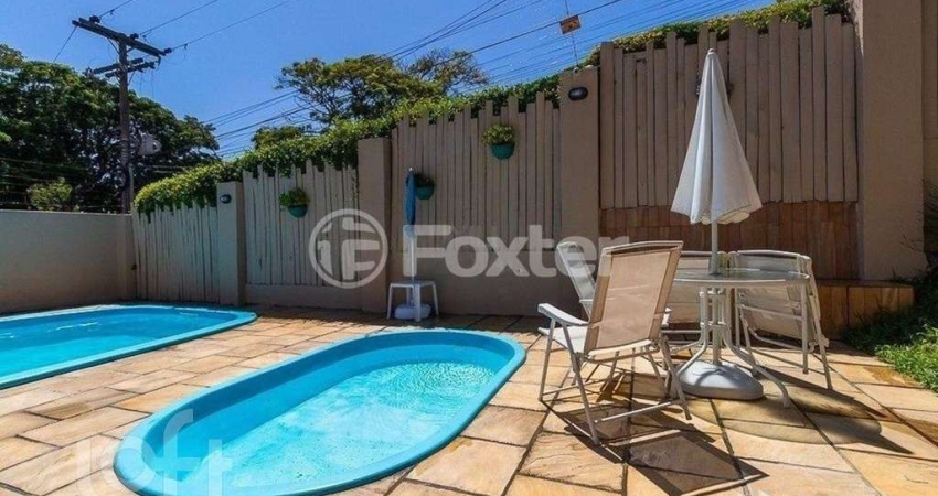 Casa em condomínio fechado com 3 quartos à venda na Rua Humberto de Campos, 601, Partenon, Porto Alegre