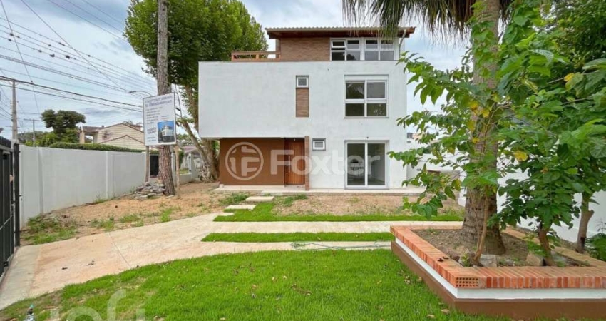 Casa com 3 quartos à venda na Rua dos Guenoas, 1200, Guarujá, Porto Alegre