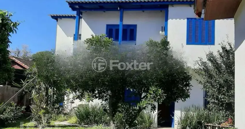 Casa com 3 quartos à venda na Rua Jacipuia, 317, Guarujá, Porto Alegre