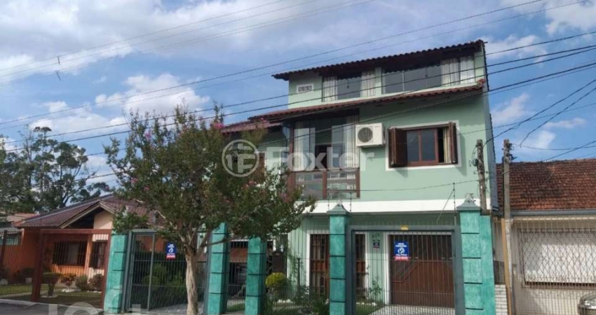 Casa com 5 quartos à venda na Rua Doutor Telmo Vergara, 554, Partenon, Porto Alegre