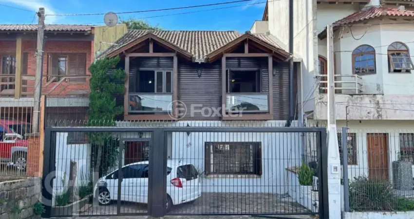 Casa com 5 quartos à venda na Rua Mata Coelho, 98, Nonoai, Porto Alegre