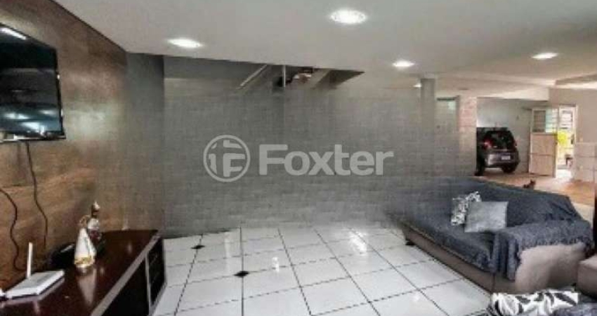 Casa com 4 quartos à venda na Rua Jerolomo Minuzo, 146, Vila Nova, Porto Alegre