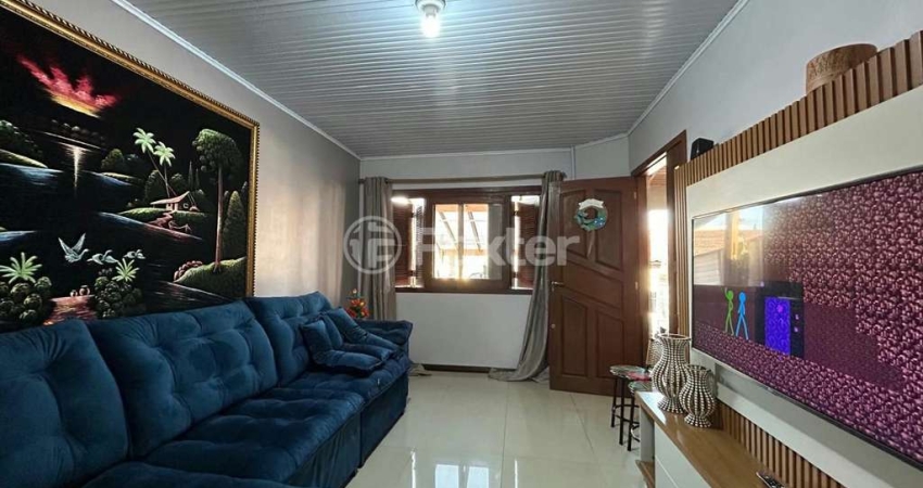 Casa com 2 quartos à venda na Rua Caturritas, 307, Jardim Algarve, Alvorada