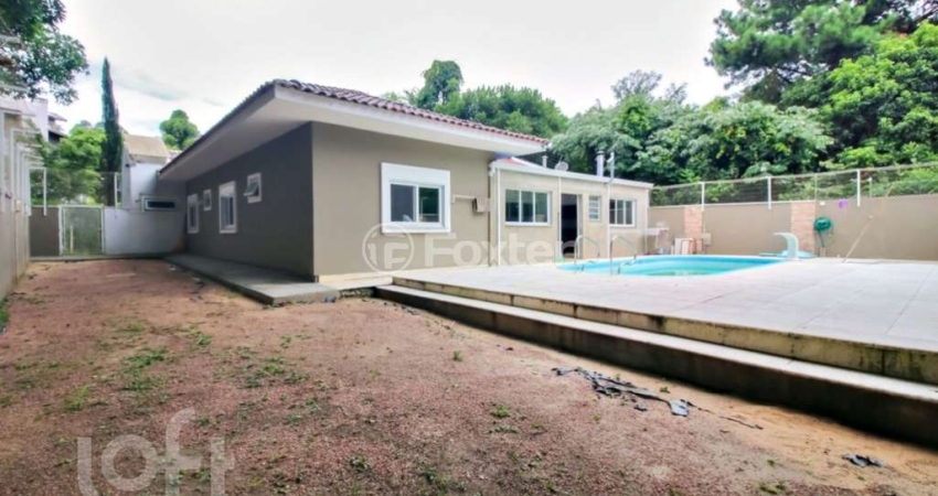 Casa em condomínio fechado com 4 quartos à venda na Rua Professor Bolívar Fontoura, 450, Vila Nova, Porto Alegre