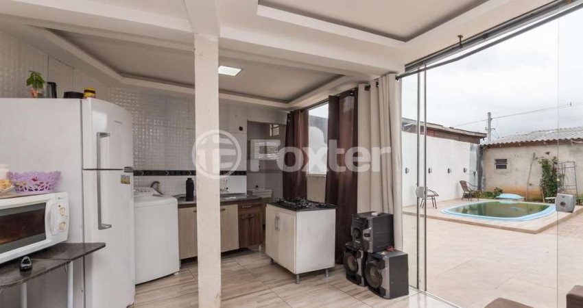 Casa com 2 quartos à venda na Rua Raul Cauduro, 150, Mário Quintana, Porto Alegre