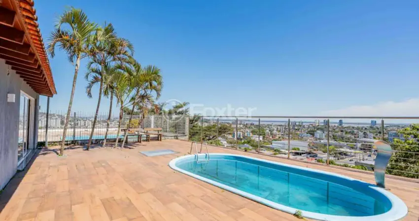 Casa em condomínio fechado com 3 quartos à venda na Rua Alcebíades Antônio dos Santos, 605, Nonoai, Porto Alegre