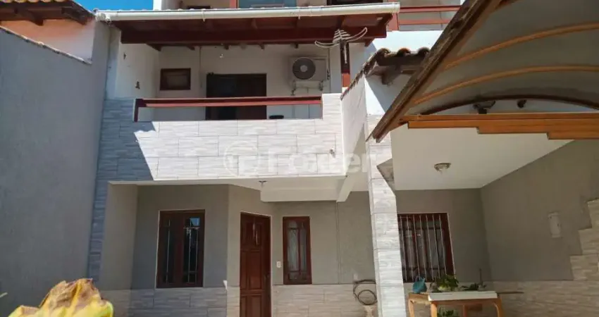 Casa com 3 quartos à venda na Rua Jacipuia, 97, Guarujá, Porto Alegre