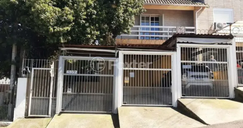 Casa com 2 quartos à venda na Rua Caiapó, 486, Vila Monte Carlo, Cachoeirinha