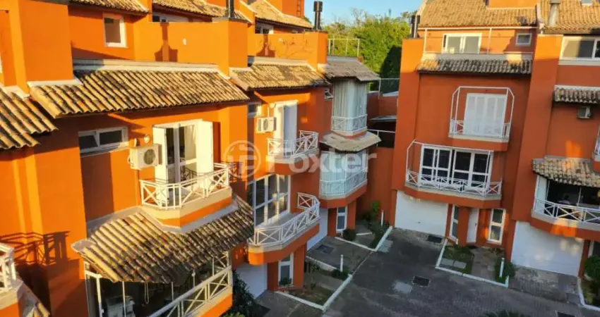 Casa em condomínio fechado com 3 quartos à venda na Avenida Guaíba, 4400, Vila Assunção, Porto Alegre