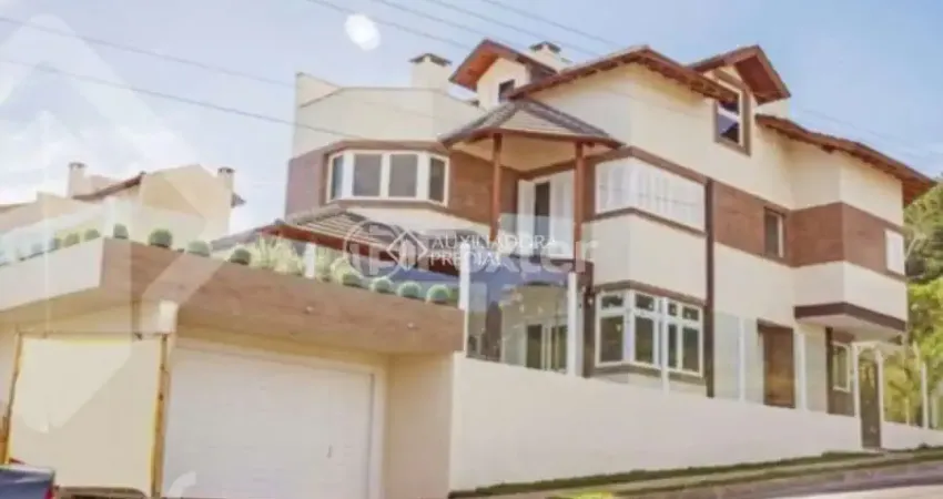 Casa com 3 quartos à venda na Rua Heitor Kramer, 540, Guarujá, Porto Alegre