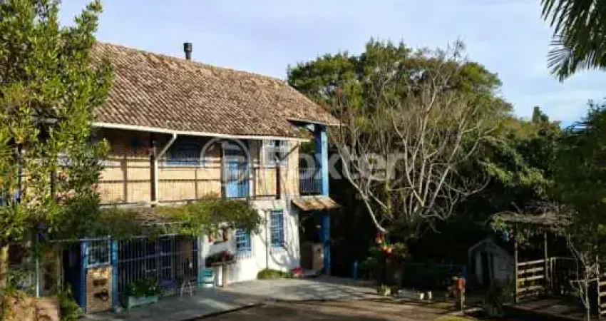 Casa com 4 quartos à venda na Estrada das Furnas, 42, Vila Nova, Porto Alegre