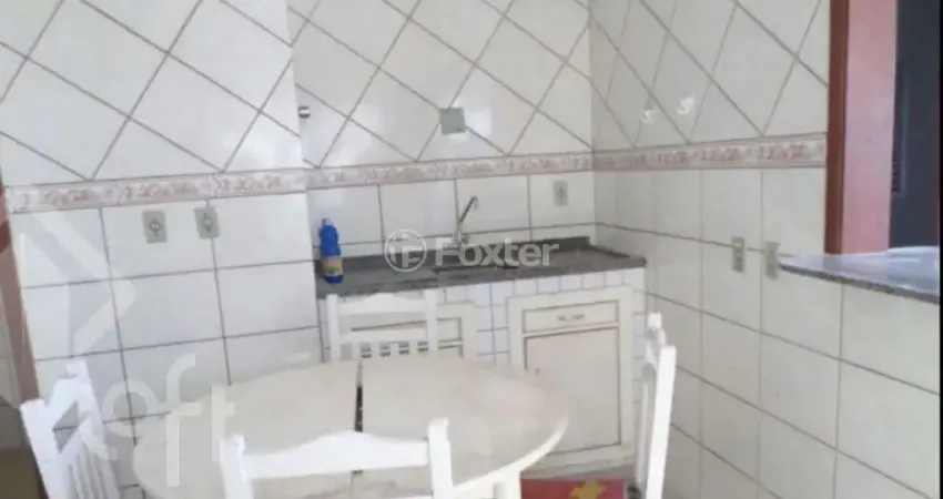 Casa com 4 quartos à venda na Rua Ângelo Passuelo, 230, Vila Nova, Porto Alegre