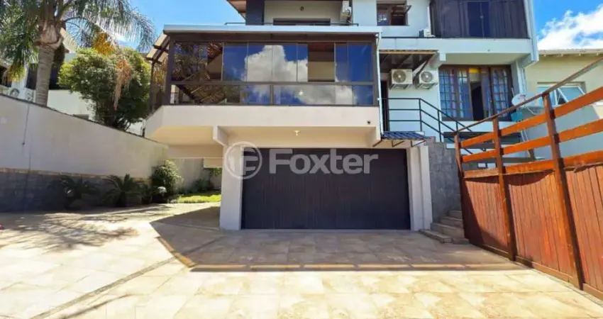 Casa em condomínio fechado com 3 quartos à venda na Rua Alcebíades Antônio dos Santos, 356, Nonoai, Porto Alegre