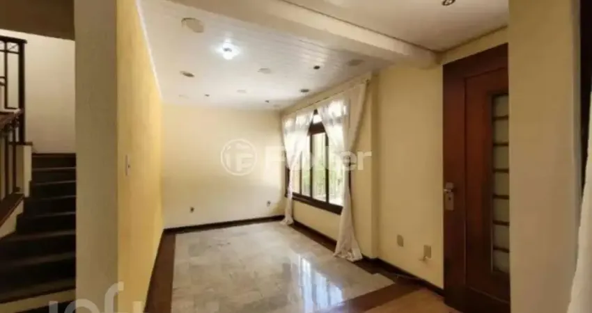 Casa com 4 quartos à venda na Rua Tupanciretã, 34, Passo da Areia, Porto Alegre