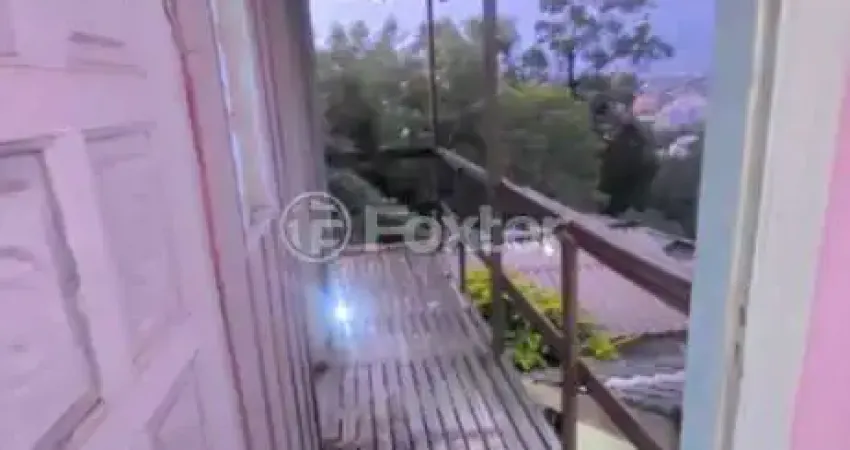 Casa com 3 quartos à venda na Rua Taveira Júnior, 799, Nonoai, Porto Alegre