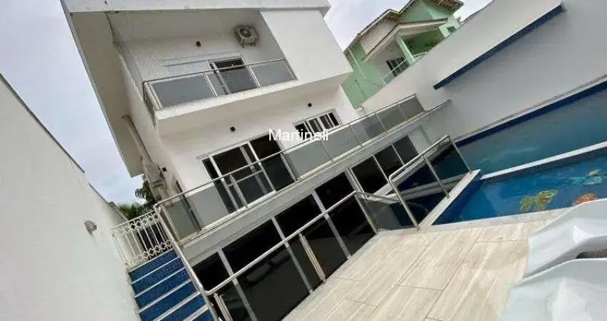Imperdível casa em condomínio com 5 quartos e 4 suítes no Centro de Itanhaém-SP!