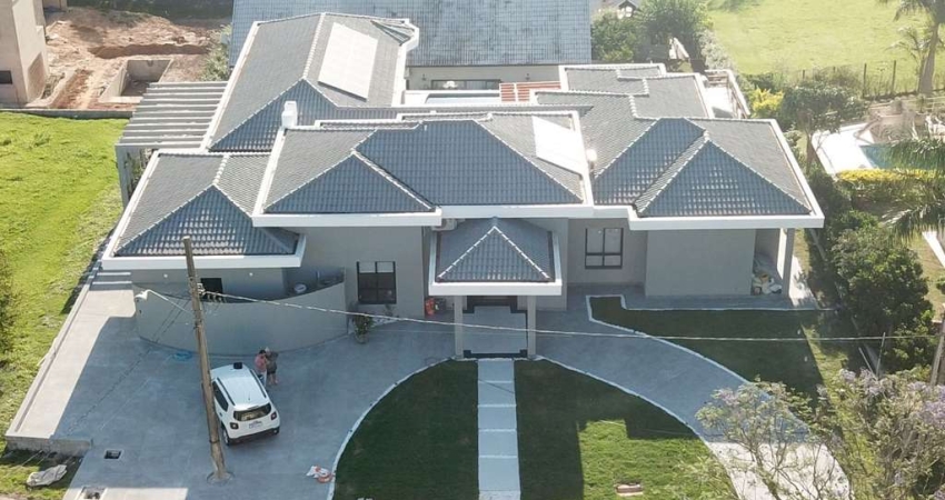 Casa com 5 dormitórios à venda, 437 m² por R$ 3.100.000 - Condomínio Vale do Lag