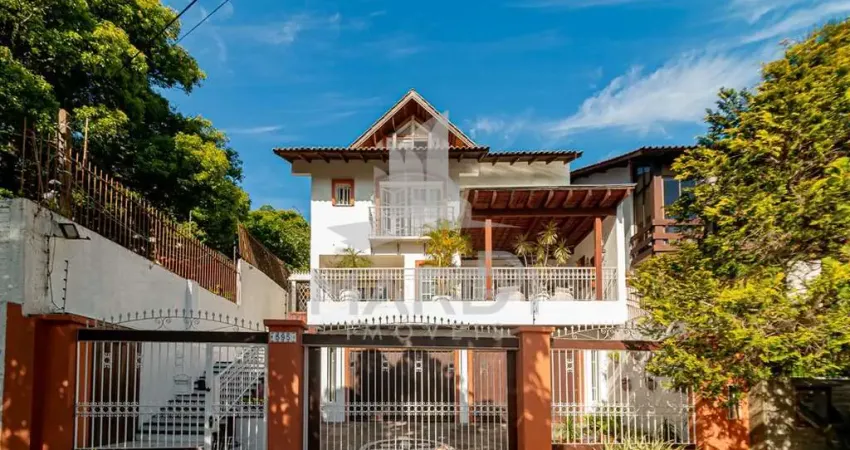 Casa com 4 quartos à venda na Avenida General Barreto Viana, 595, Chácara das Pedras, Porto Alegre