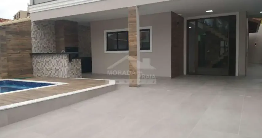Sobrado ISOLADO de alto padrão no Flórida, 3 suítes, 4 vagas, piscina, confira em Praia Grande.
