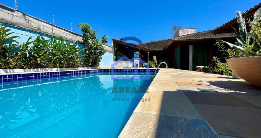 Casa à venda no bairro Prainha em Caraguatatuba, a 300 metros da praia com 4 dormitórios, sendo 3 s