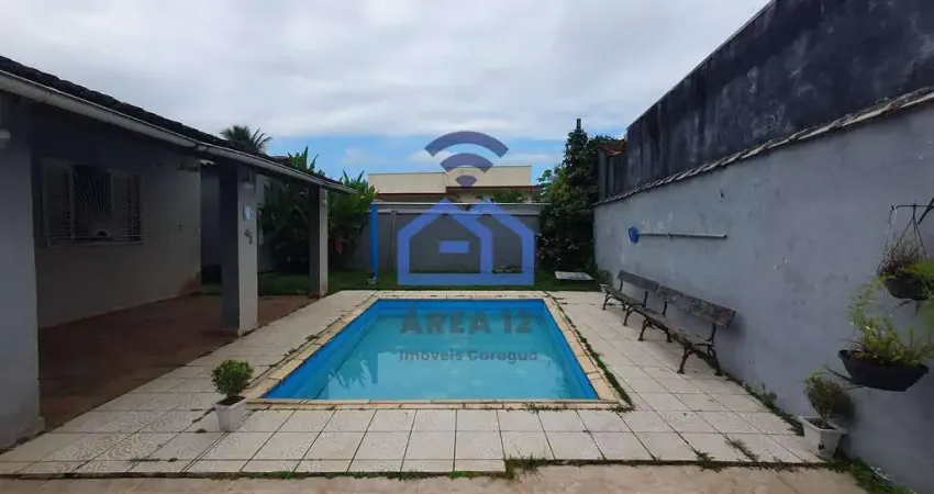 Casa mobiliada à venda em condomínio no bairro do Massaguaçu em Caraguatatuba, SP - piscina, churra
