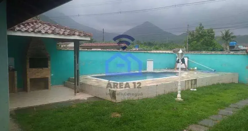 Casa de 3 dormitórios à venda no bairro do Massaguaçu em Caraguatatuba, SP - Com piscina e área gou