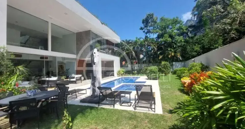 Luxuosa casa de 5 suítes em são conrado - rio de janeiro-rj: 911m² de arquitetura impecável e 4 vagas na garagem!