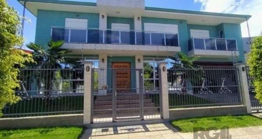 Casa em Porto Alegre, no bairro Hípica, com 3 dormitório(s), e 3 banheiros, à venda.