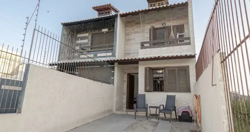 Casa com 3 quartos à venda na Rua Heitor Kramer, 571, Guarujá, Porto Alegre