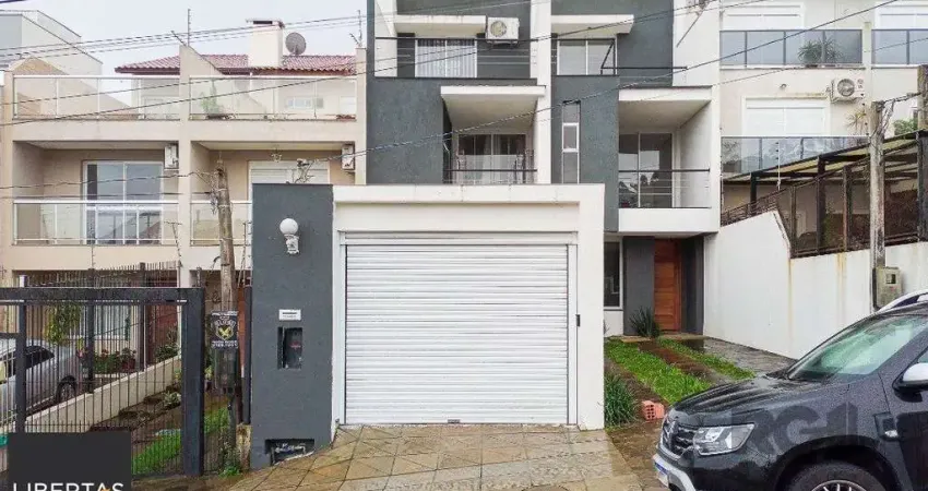 Casa com 3 quartos à venda na Rua Heitor Kramer, 680, Guarujá, Porto Alegre