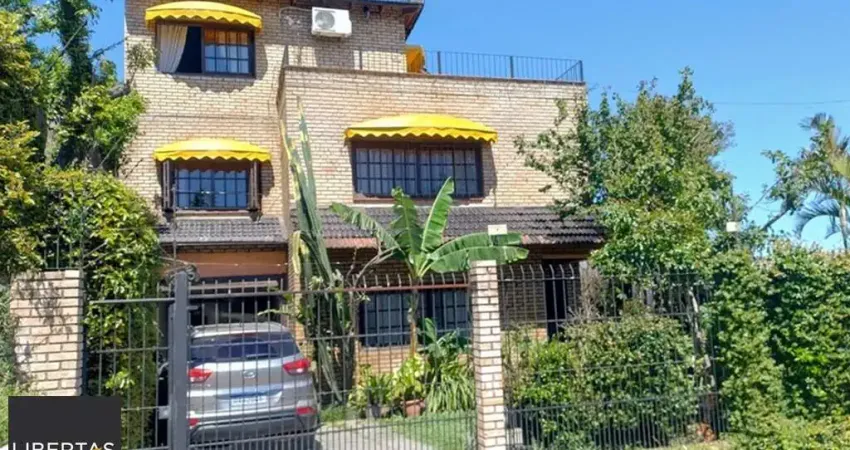 Casa com 4 quartos à venda na Rua Arapei, 325, Cristal, Porto Alegre