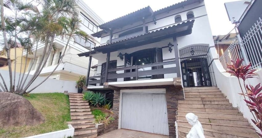 Casa com 5 dormitórios para alugar, 382 m² por R$ 7.000,00/mês - Tristeza - Port