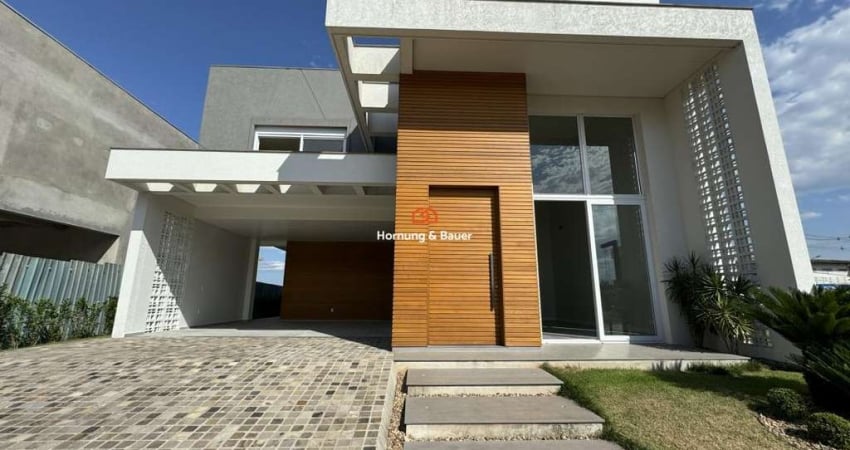 Casa à venda em Condomínio fechado, Nelsi Haas no Centro de Portão - com três Suítes e piscina.