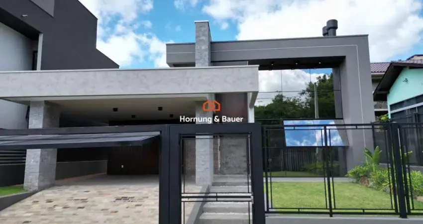 Casa nova à venda em ivoti no loteamento carolina-com três suítes, lareira e espaço gourmet.