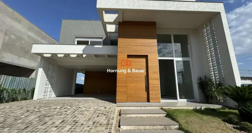 Casa à venda em condomínio fechado, nelsi haas no centro de portão - com três suítes e piscina.