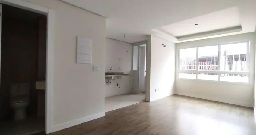 Apartamento 1 dormitório com suíte, cozinha americana, lavabo e amplo living no bom fim!