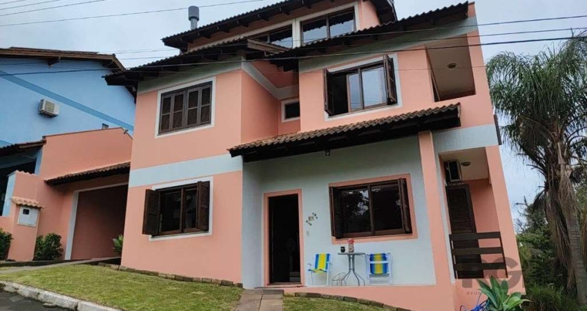 Casa em condomínio fechado com 4 quartos à venda na Avenida Vicente Monteggia, 2088, Cavalhada, Porto Alegre