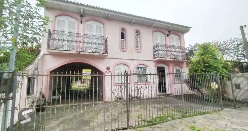 Casa com 3 quartos à venda na Rua Jacipuia, 420, Guarujá, Porto Alegre