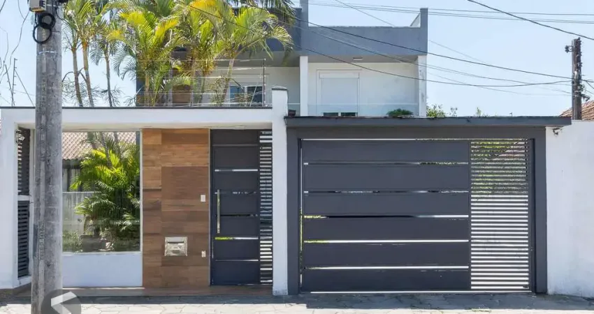 Excelente casa de 3 dormitórios, 3 suítes e 2 vagas no bairro cavalhada.