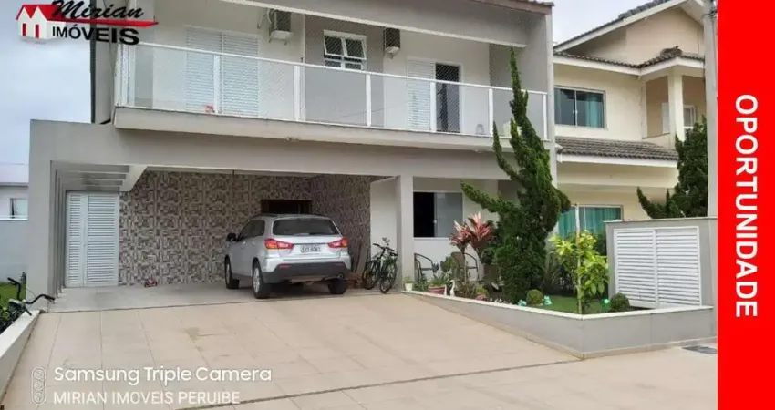 Sobrado a venda em peruibe com 4 suites , espaço gourmet, piscina em condomínio fechado em peruibe
