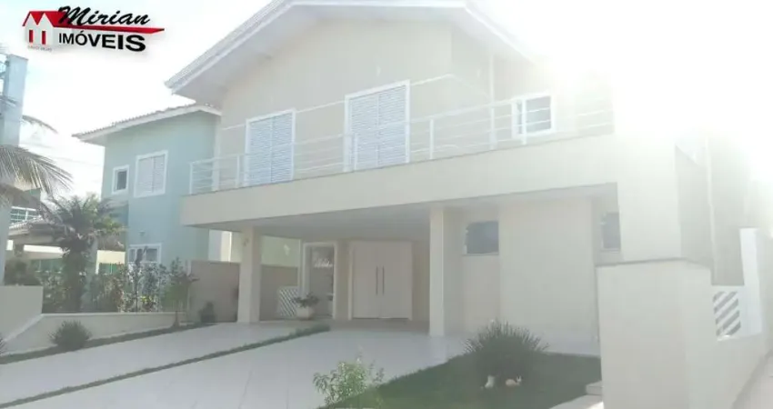 Sobrado em condomínio fechado em peruibe , condomínio frente para o mar , 4 suites com piscina