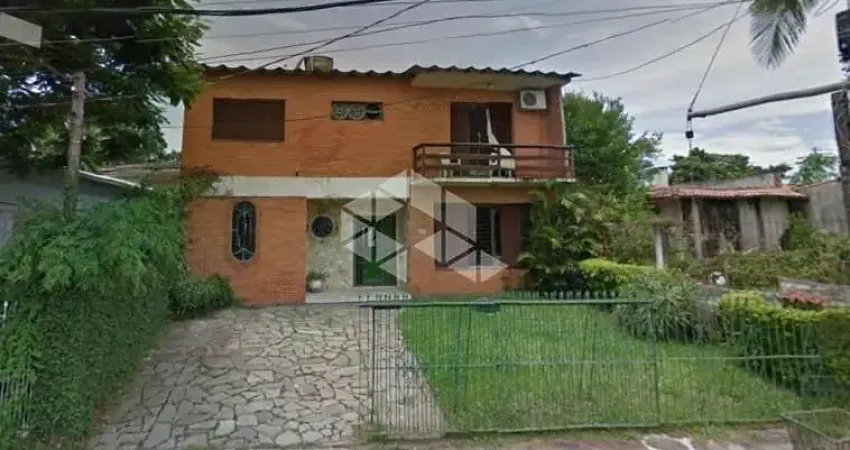 Casa com 3 quartos à venda na Rua Jacundá, 670, Guarujá, Porto Alegre
