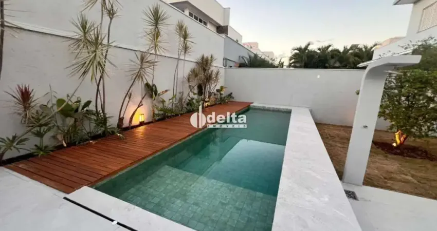 Casa em condomínio com 3 suítes disponível para venda no bairro laranjeiras em uberlândia - mg.