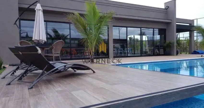 Casa térrea 4 suítes completas em armários e banheiros com hidromassagem.