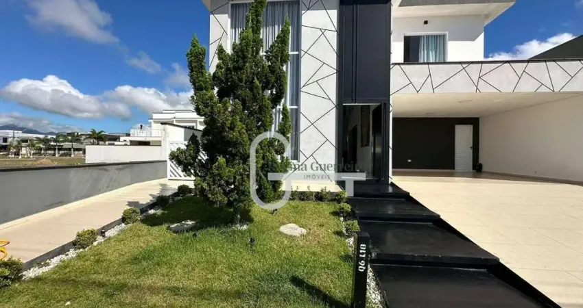 Casa com 3 dormitórios à venda, 223 m² por R$ 1.500.000,00 - Condomínio Flora Rica - Peruíbe/SP