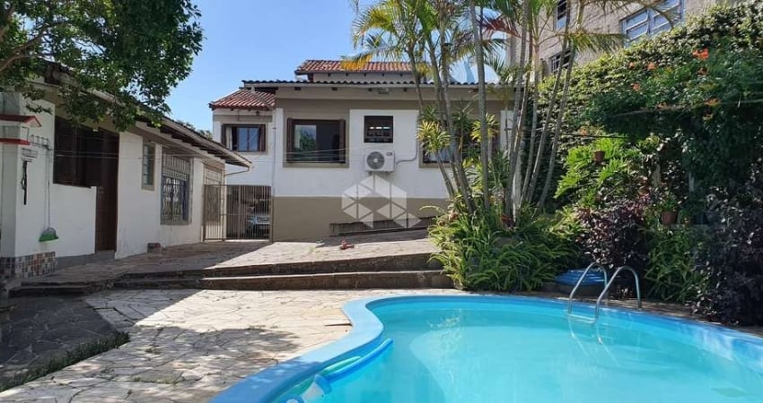 Casa com 4 quartos à venda na Rua Primeiro de Maio, 42, Partenon, Porto Alegre