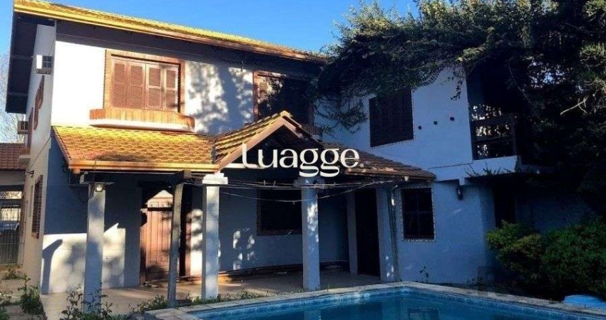 Casa de 365m² - 4 dormitórios sendo 3 suítes e 5 vagas de garagem no bairro Partenon